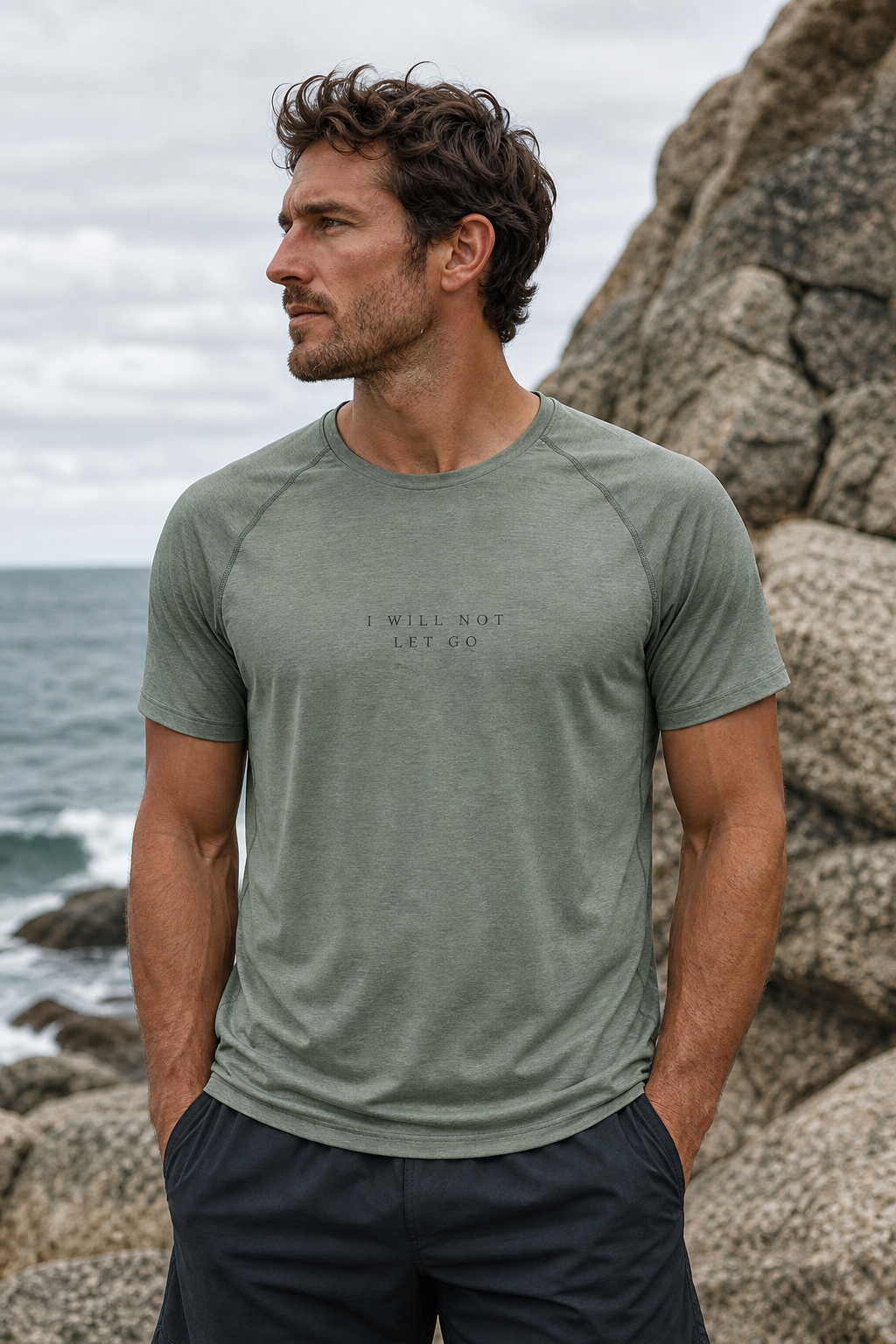 Sage tee, I WILL NOT LET GO letterspaced small and tonal on the chest.